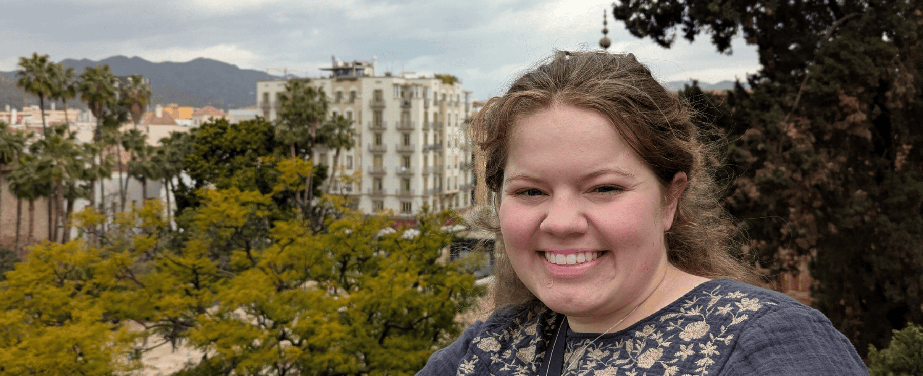 Loyola student Gretchen Rojewski smiles outside during a study abroad trip